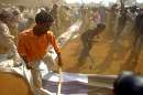 thumb for Indian Muslim protesters hit and tear poster of US President Bush during protest rally in Mumbai