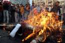 thumb for Communist activists burn effigy of US President Bush in front of American center in Kolkata